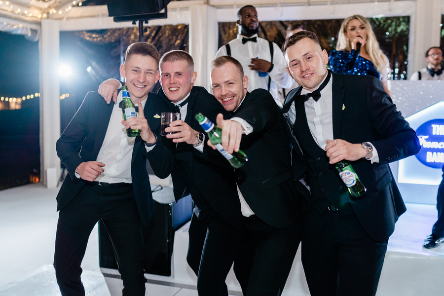 Groomsmen dancing to The Function Band at Suffolk marquee wedding