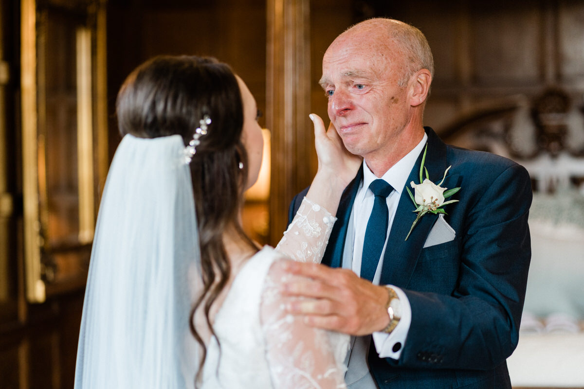 Dad and daughter moment during wedding at Hengrave Hall