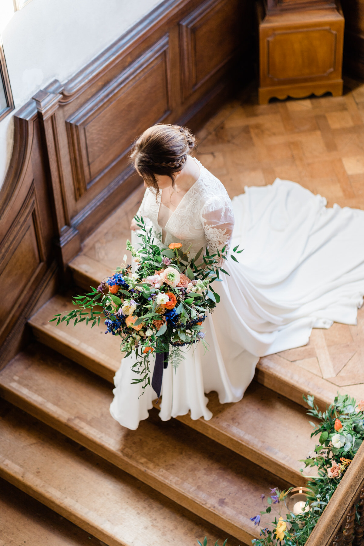 Bridal photo from above on the staircase at Glemham Hall