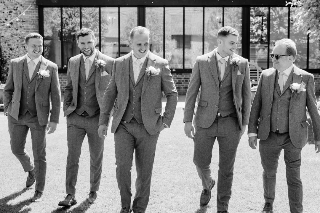 Groomsmen in the courtyard at the granary estates